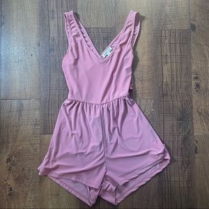 Pink romper cross cross back